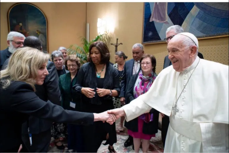 Marywood President Lisa A. Lori greeting/shaking hands with Pope Francis.