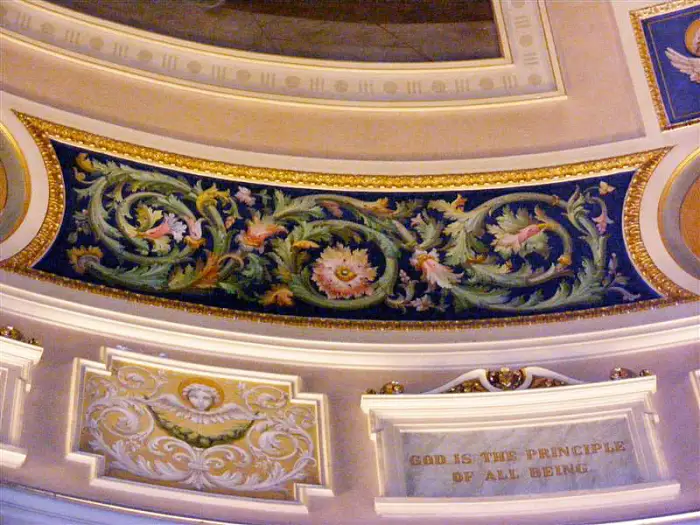 an image of plaques that are below the murals in the campus rotunda 